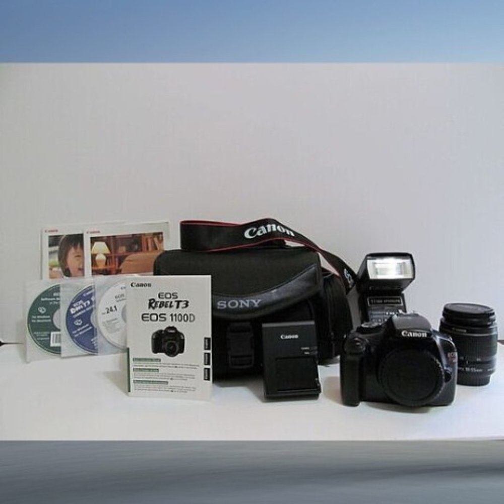 CANON EOS REBEL T3 EOS 1100D BUNDLE CHARGER, BATTERY, LENS, FLASH, CD'S, BOOKLET